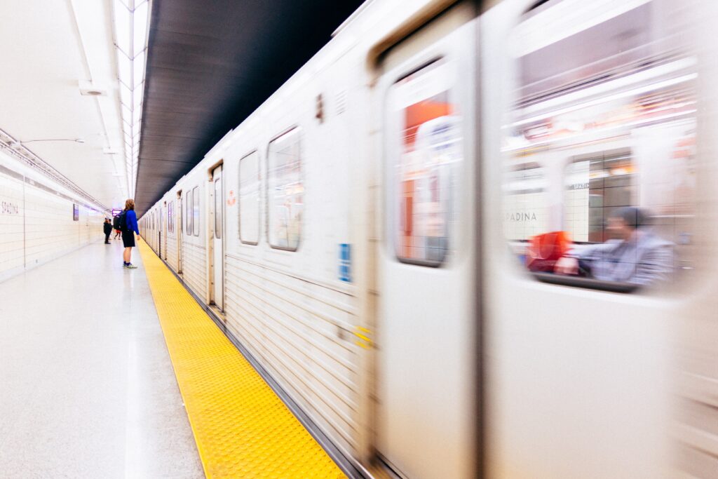 Subway train going past platform.