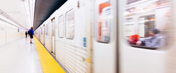 Subway train going past platform.
